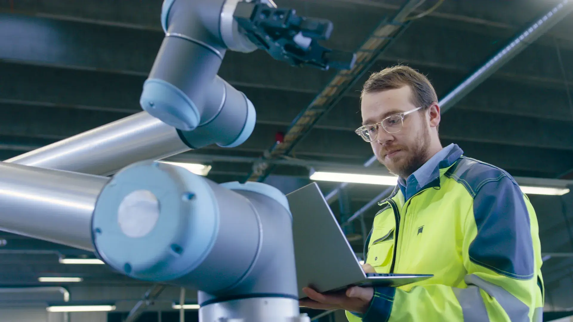 Industrial robotic equipment working inside a factory cell